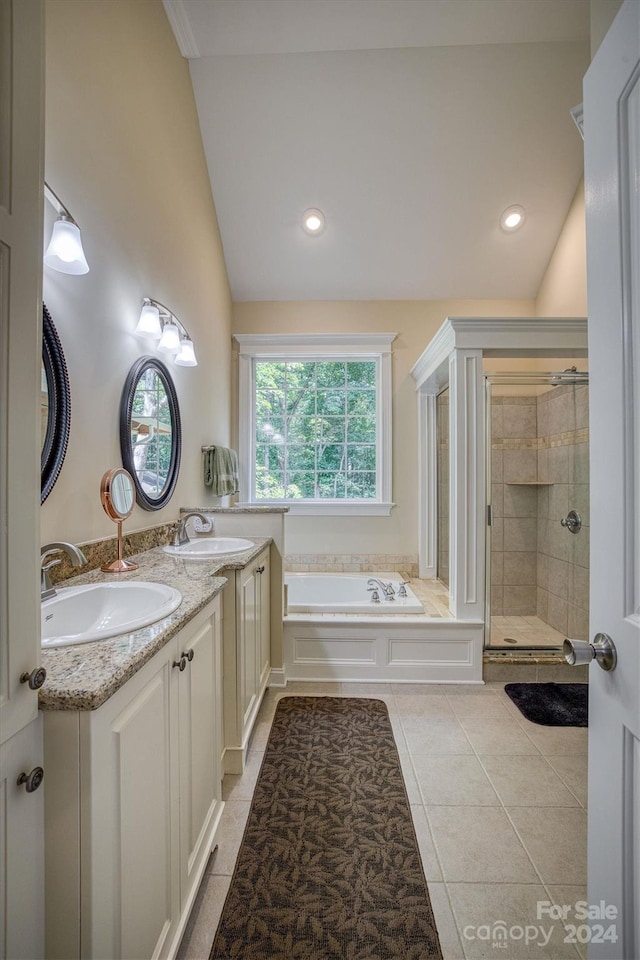 bathroom featuring tile patterned floors, lofted ceiling, and shower with separate bathtub