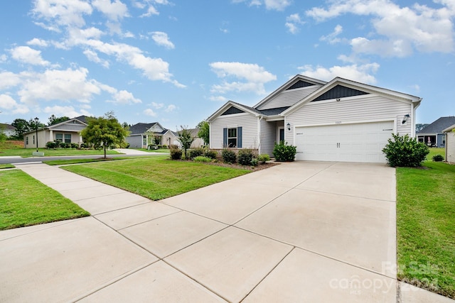 view of front of home with a garage and a front lawn