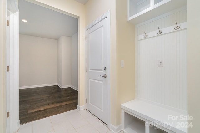 mudroom with light tile patterned floors