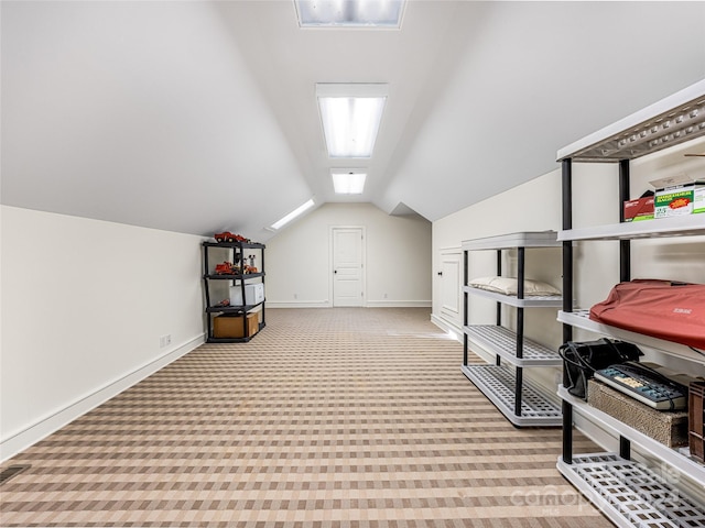 bonus room featuring light colored carpet and lofted ceiling