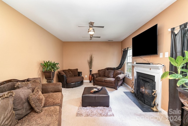 carpeted living room featuring ceiling fan