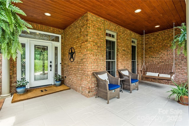 doorway to property with a porch