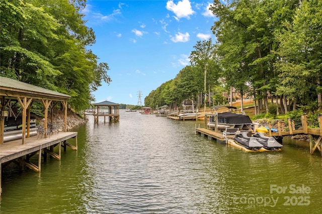 dock area featuring a gazebo and a water view