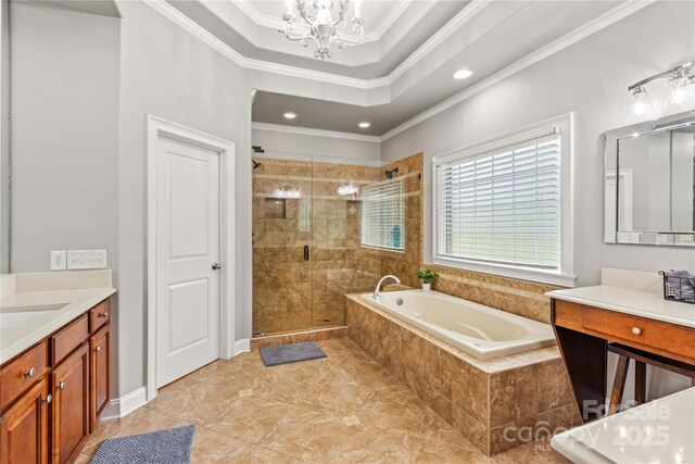 bathroom featuring vanity, ornamental molding, independent shower and bath, and an inviting chandelier