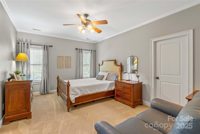 bedroom featuring crown molding, light colored carpet, and ceiling fan