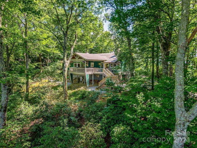 back of property with a wooden deck