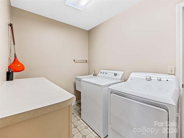 clothes washing area featuring independent washer and dryer