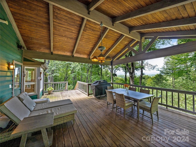 wooden terrace with a grill