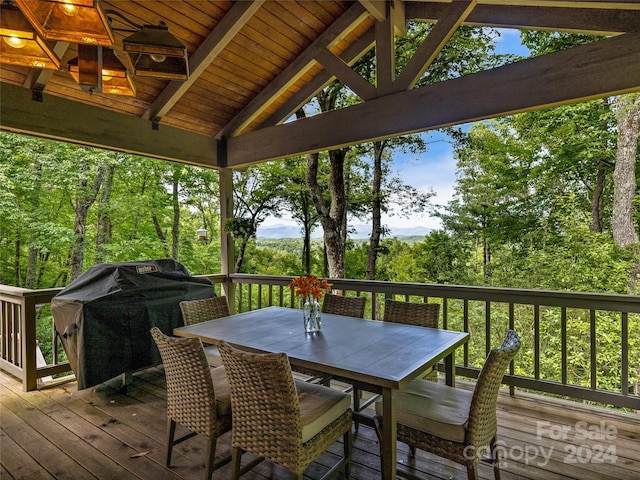 wooden deck featuring area for grilling