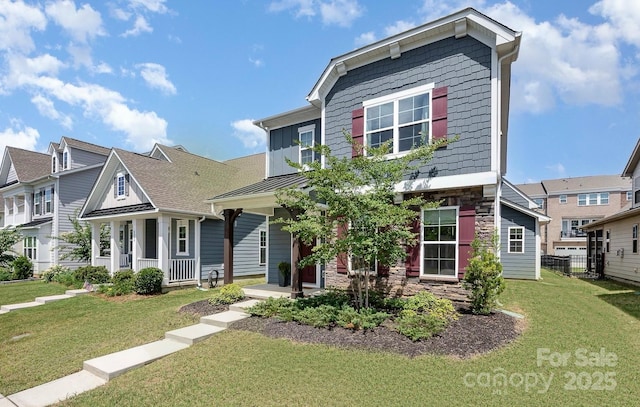 view of front of property featuring a front lawn and a porch