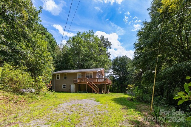 view of yard featuring a wooden deck