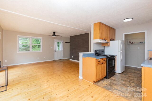 kitchen with black / electric stove, white fridge, ceiling fan, and light wood-type flooring