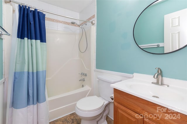 full bathroom with toilet, vanity, and shower / bath combination with curtain