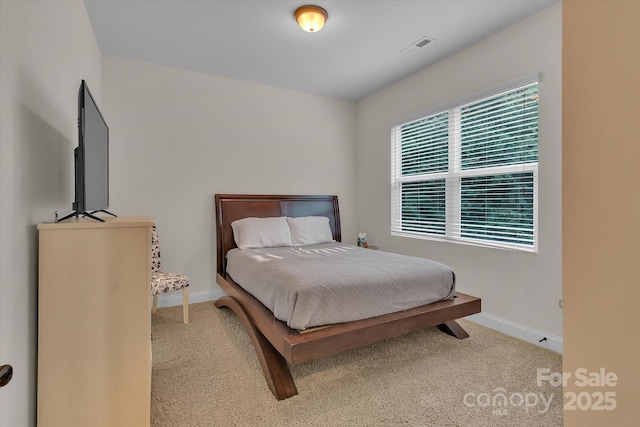 bedroom featuring light colored carpet