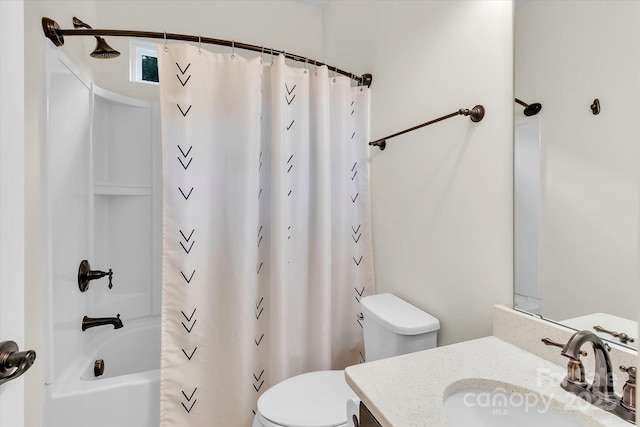 full bathroom featuring shower / bathtub combination with curtain, vanity, and toilet