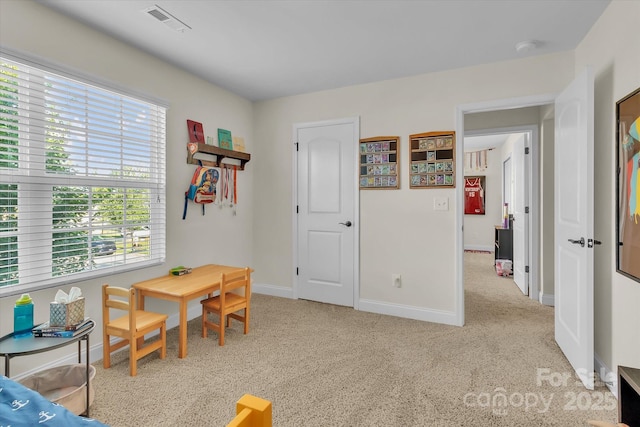 game room featuring light colored carpet