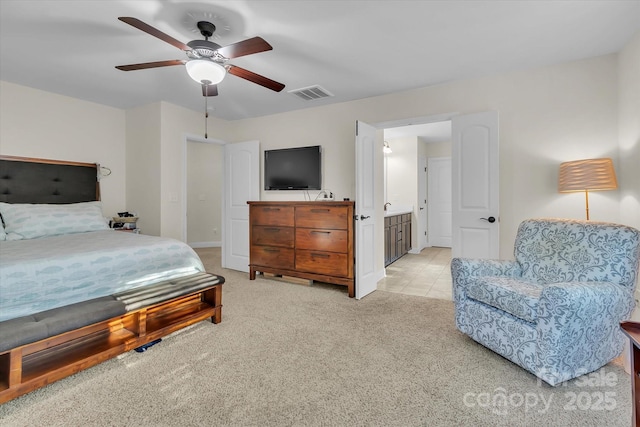 bedroom with ceiling fan and light colored carpet