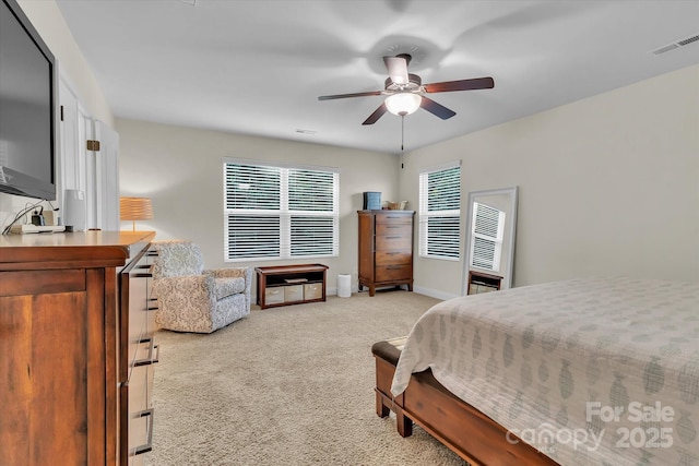 carpeted bedroom with ceiling fan