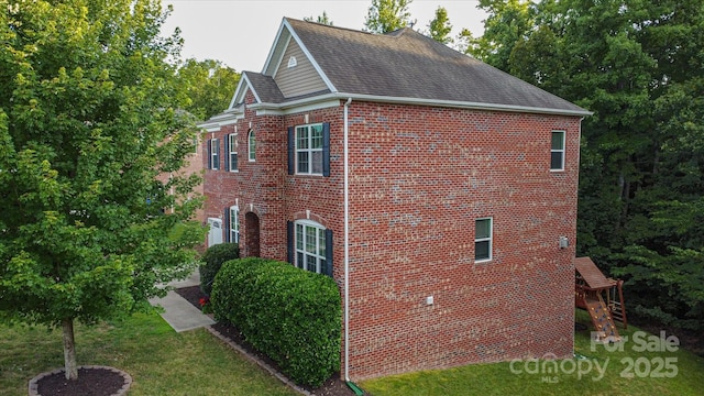 view of home's exterior with a yard