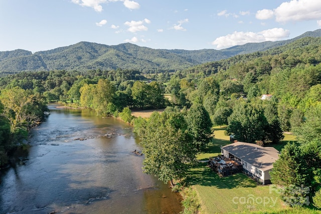 aerial view featuring a water and mountain view