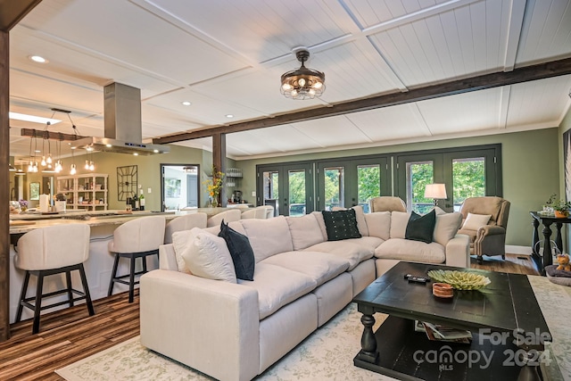 living room with wood-type flooring and french doors