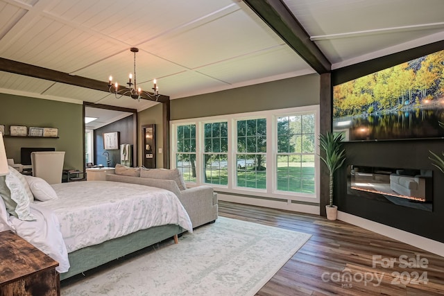 bedroom with wood-type flooring, lofted ceiling, and an inviting chandelier