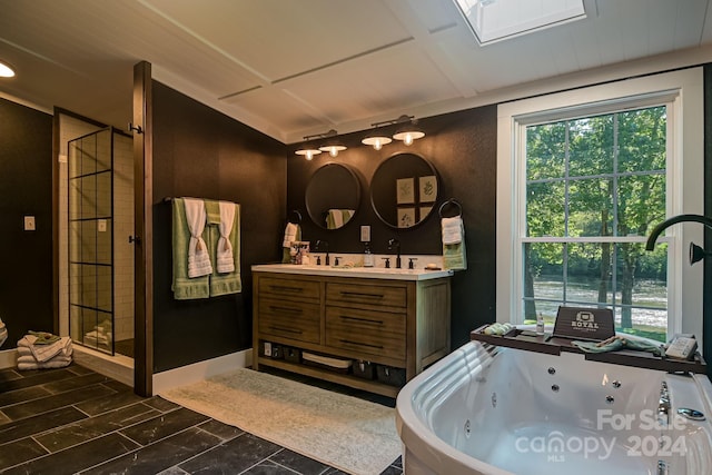 bathroom with vanity and independent shower and bath