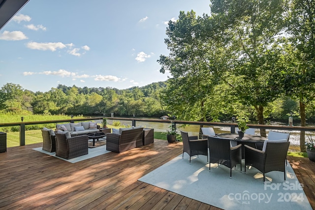 deck with central AC and an outdoor living space