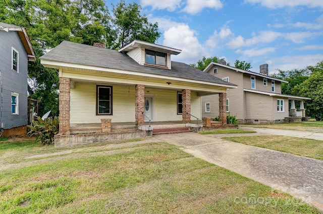 view of front of house featuring a front lawn and a porch