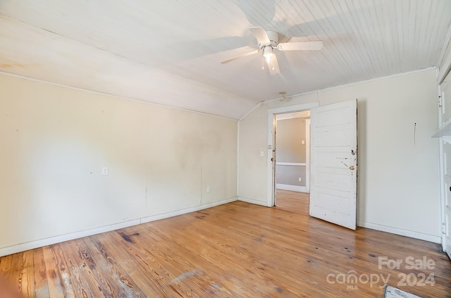 unfurnished room featuring wood-type flooring, ceiling fan, and lofted ceiling