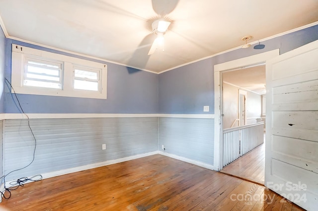 unfurnished room featuring ornamental molding and hardwood / wood-style floors