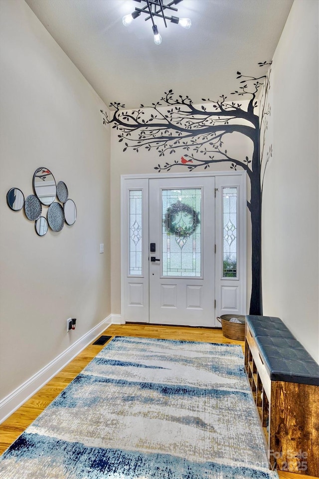 foyer entrance featuring hardwood / wood-style floors