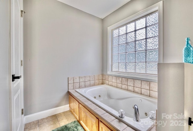 bathroom with a bath, a wealth of natural light, and tile patterned floors