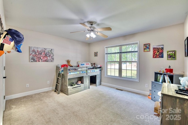 bedroom featuring ceiling fan and light carpet