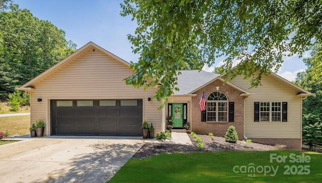 5692 Marblestone Dr, Granite Falls, NC 28630 - view of front facade with an attached garage, driveway, a front lawn, and brick siding