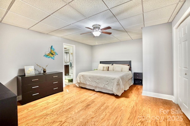 5692 Marblestone Dr, Granite Falls, NC 28630 - bedroom featuring light wood-type flooring, a drop ceiling, a closet, baseboards, and a ceiling fan