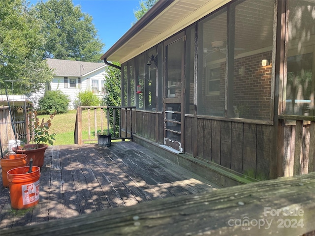 wooden terrace featuring a sunroom