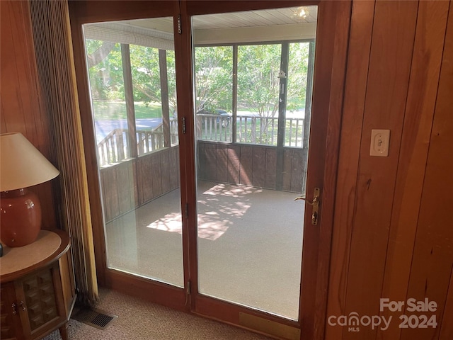 entryway with carpet floors