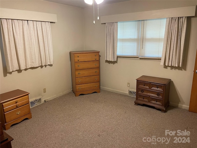 bedroom featuring light colored carpet