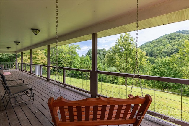 wooden deck with a lawn