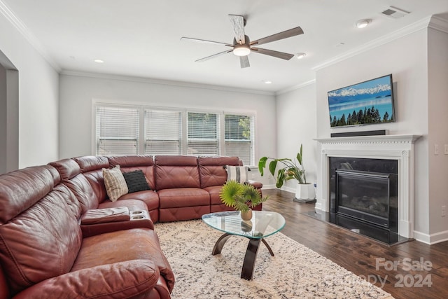 living room featuring ceiling fan, dark hardwood / wood-style floors, and ornamental molding