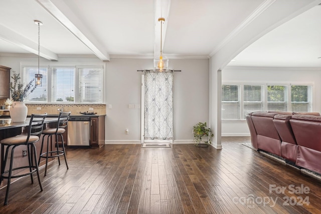 dining area with dark hardwood / wood-style floors, beamed ceiling, and crown molding