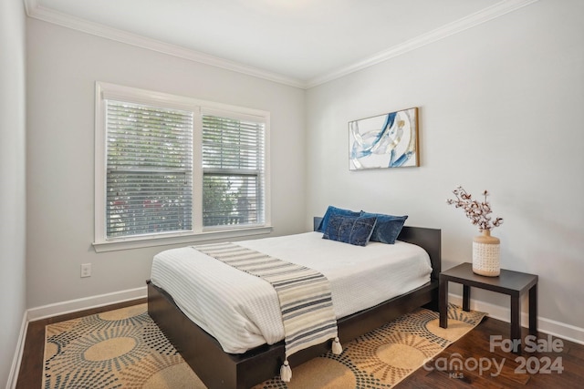 bedroom featuring hardwood / wood-style floors and ornamental molding