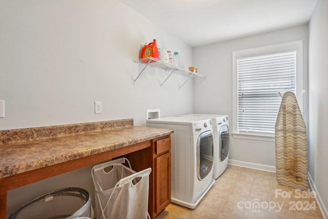 clothes washing area featuring washing machine and dryer