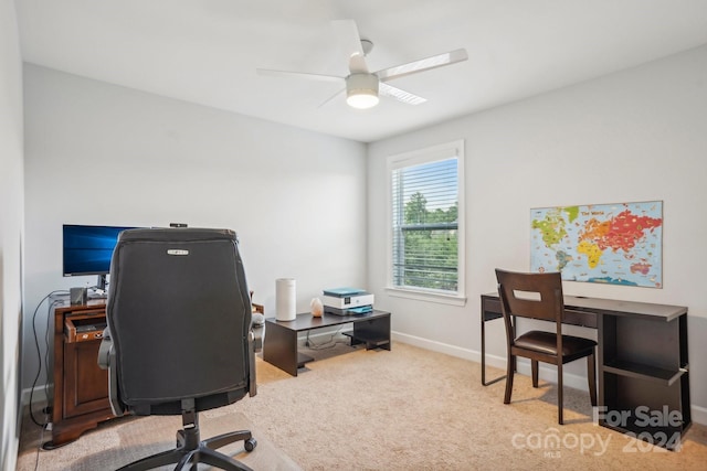 home office with ceiling fan and carpet