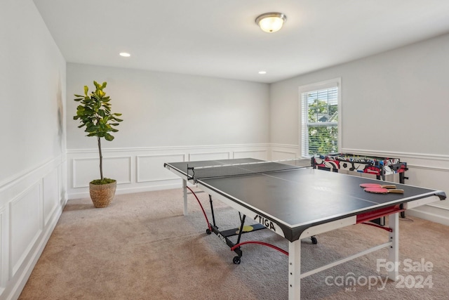 recreation room with light carpet