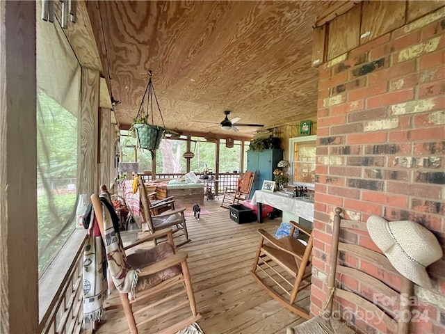 exterior space featuring ceiling fan and wood ceiling