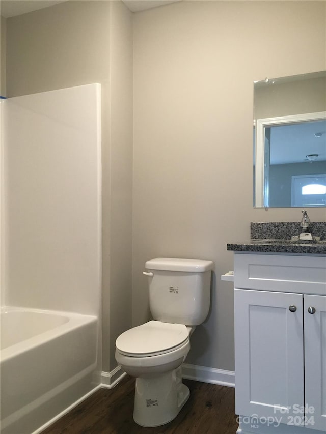 bathroom featuring hardwood / wood-style floors, vanity, and toilet