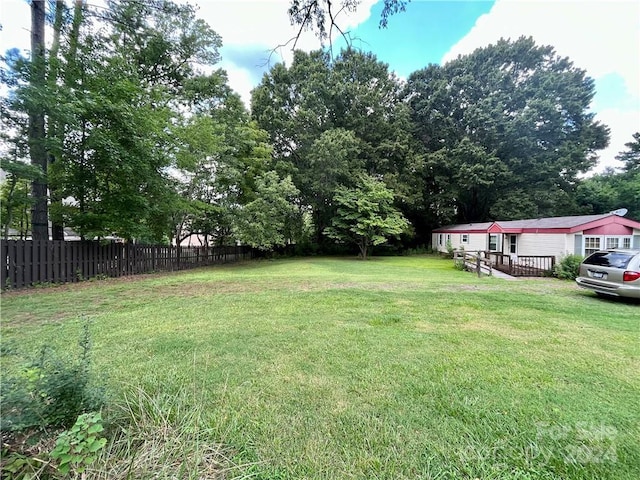 view of yard featuring a wooden deck