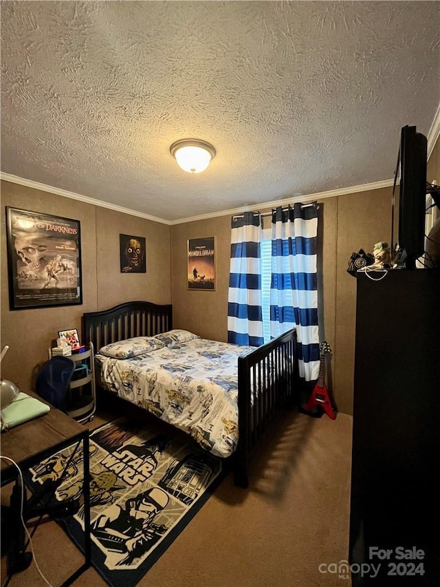 carpeted bedroom with a textured ceiling and ornamental molding